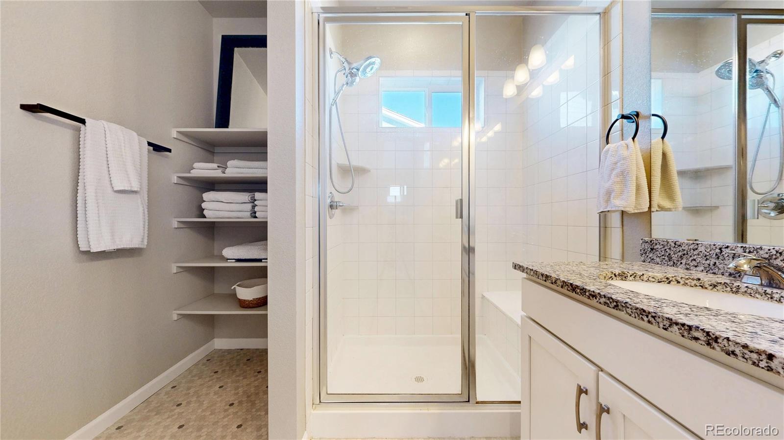 1107 Basalt Ridge Loop Castle Rock, CO 80108 - Photo 32 of 50 a bathroom with a sink and a mirror
