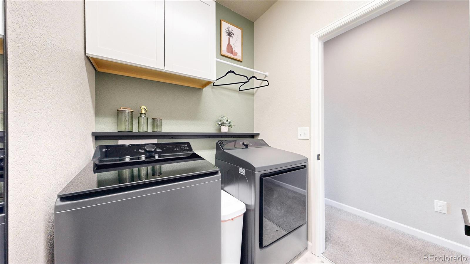 1107 Basalt Ridge Loop Castle Rock, CO 80108 - Photo 34 of 50 a kitchen with stainless steel appliances granite countertop a stove and a sink