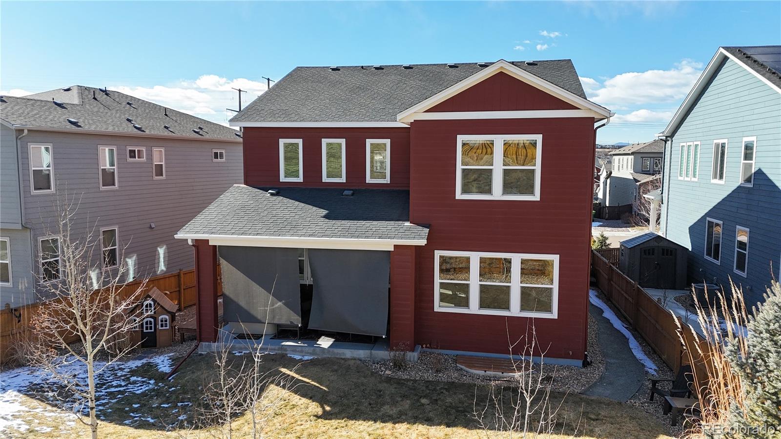 1107 Basalt Ridge Loop Castle Rock, CO 80108 - Photo 42 of 50 a front view of a house with a yard