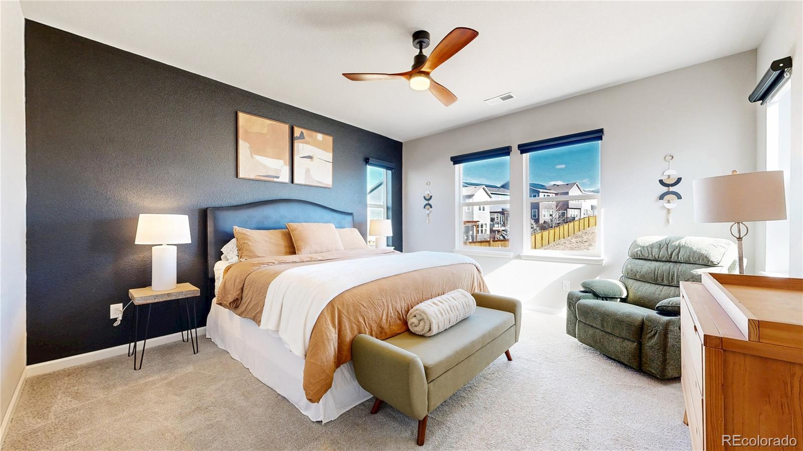 1107 Basalt Ridge Loop Castle Rock, CO 80108 - Photo 5 of 50 a bedroom with a bed couch and window