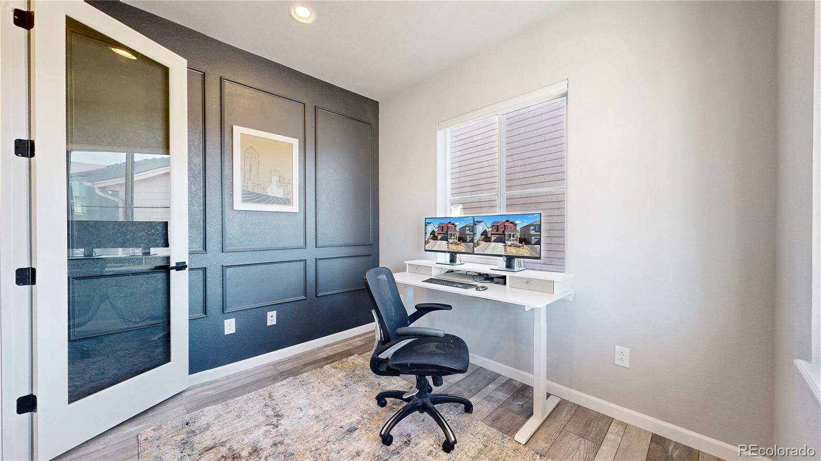 1107 Basalt Ridge Loop Castle Rock, CO 80108 - Photo 7 of 50 a view of workspace with wooden floor and bathroom