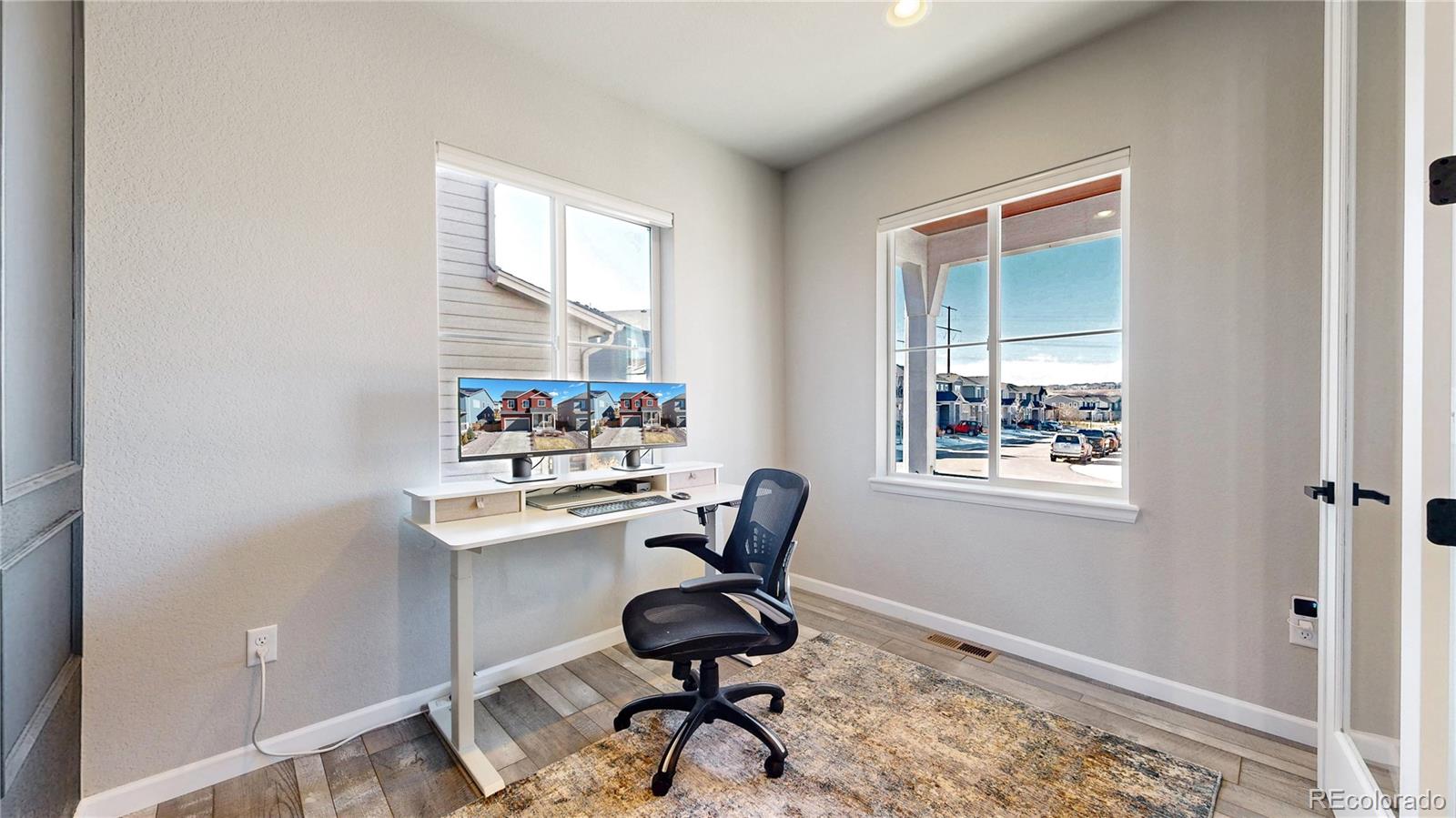 1107 Basalt Ridge Loop Castle Rock, CO 80108 - Photo 8 of 50 a view of a workspace with furniture and a window