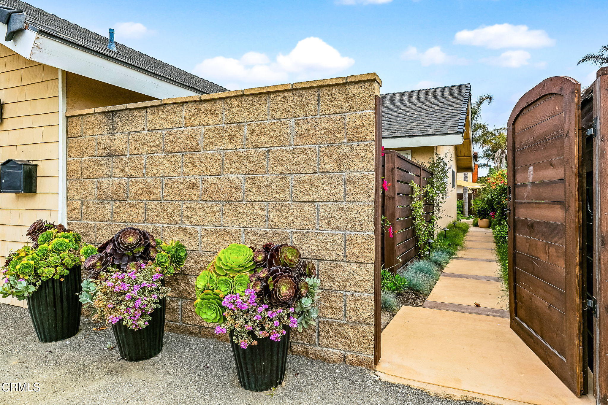 4930 Dolphin Way Oxnard, CA 93035 - Photo 2 of 44 a view of a garden with flowers