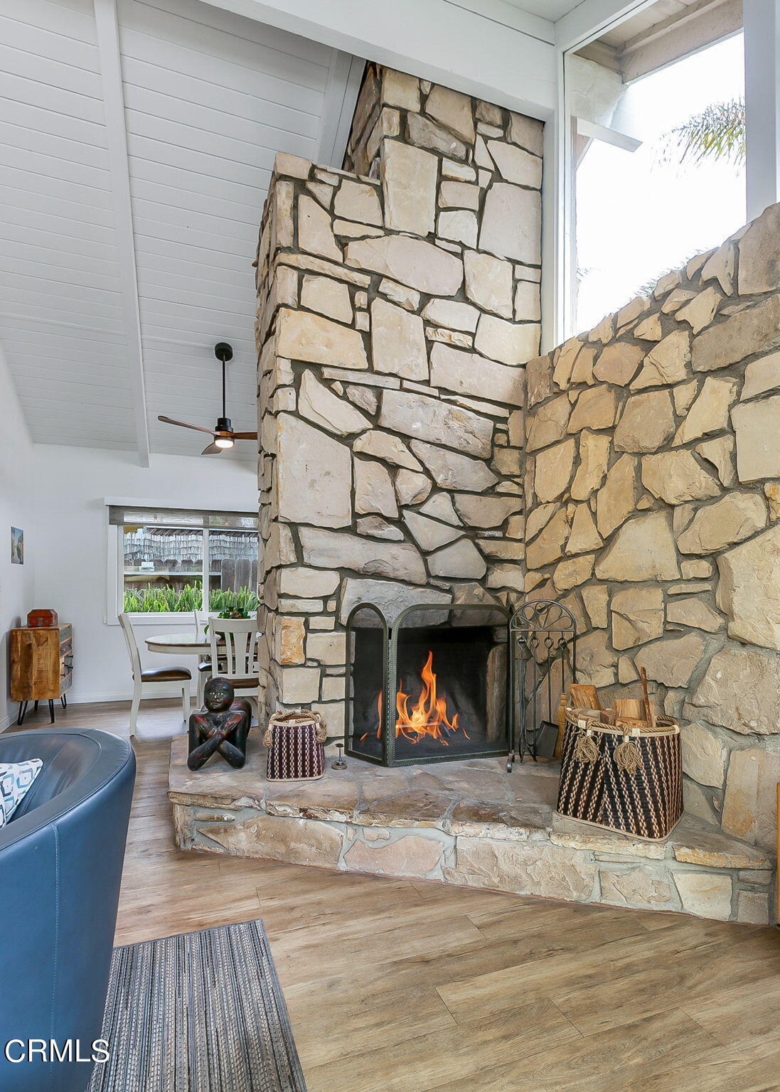 4930 Dolphin Way Oxnard, CA 93035 - Photo 11 of 44 a living room with a couch and a fireplace with wooden floor