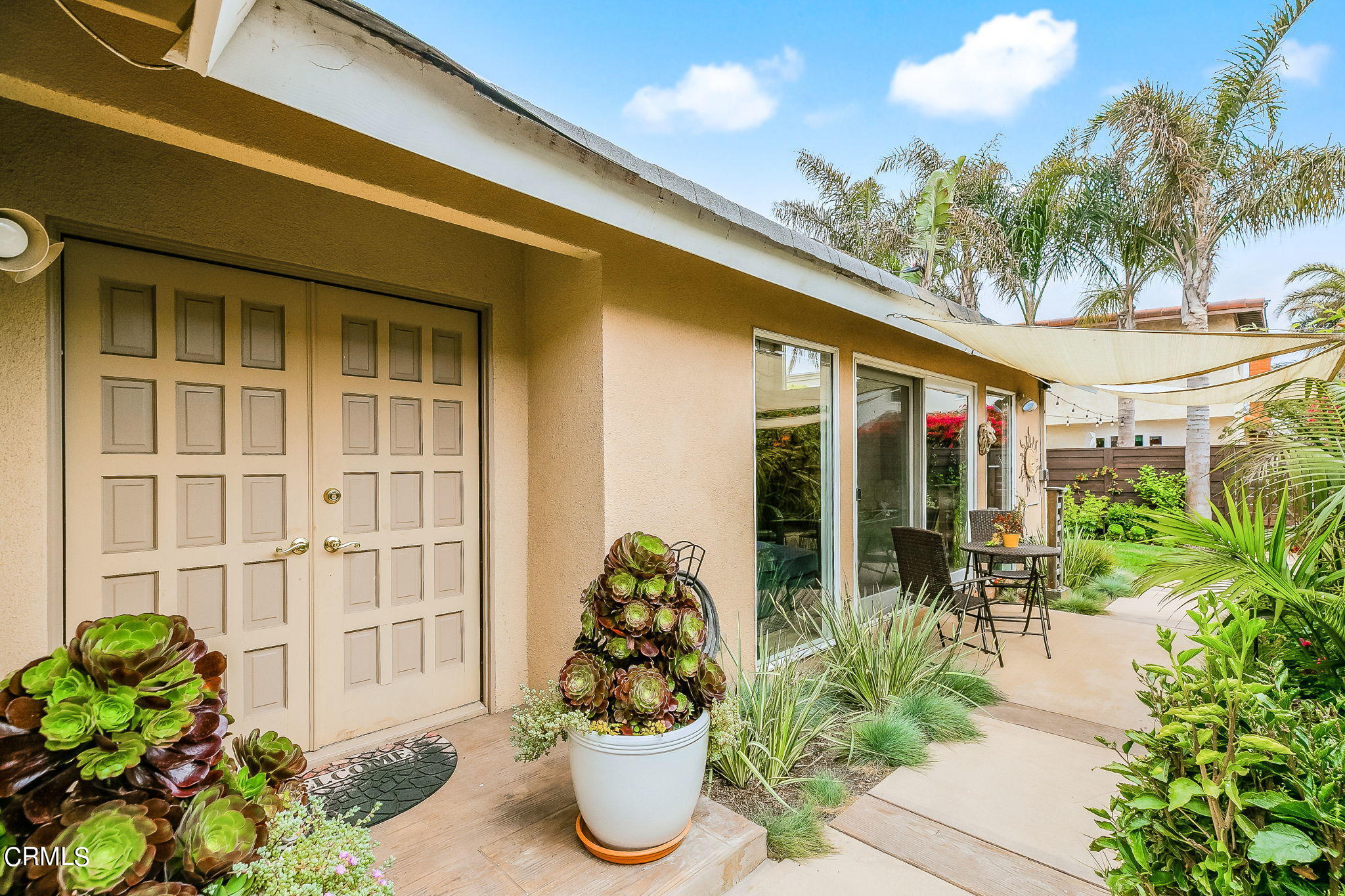 4930 Dolphin Way Oxnard, CA 93035 - Photo 3 of 44 a flower pot with a table and chairs
