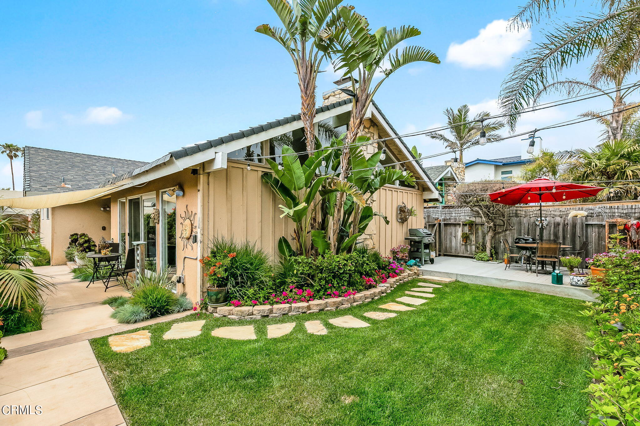 4930 Dolphin Way Oxnard, CA 93035 - Photo 24 of 44 a patio with a yard table and chairs