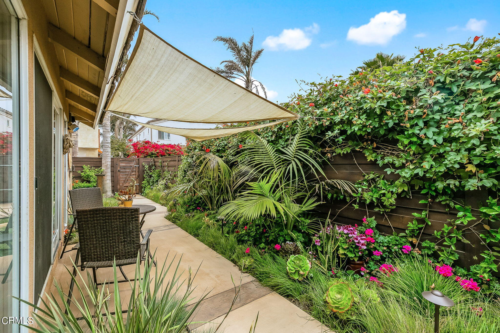 4930 Dolphin Way Oxnard, CA 93035 - Photo 25 of 44 a patio with table and chairs and potted plants