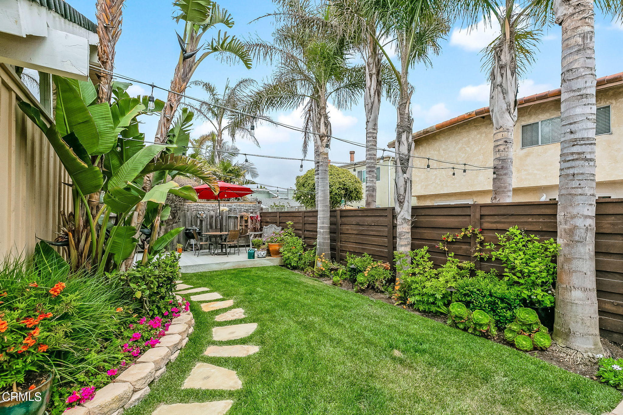 4930 Dolphin Way Oxnard, CA 93035 - Photo 28 of 44 a backyard of a house with lots of green space