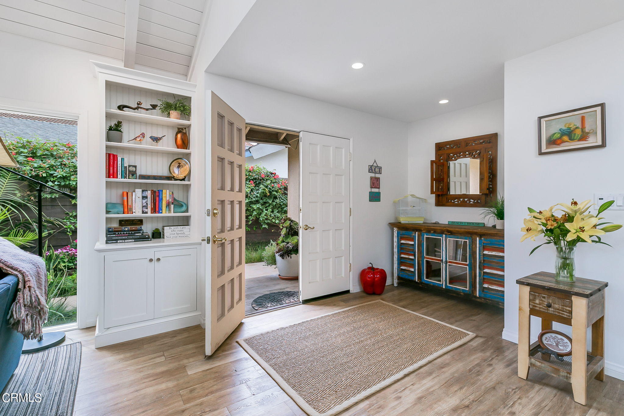 4930 Dolphin Way Oxnard, CA 93035 - Photo 6 of 44 a living room with furniture a potted plant and kitchen view