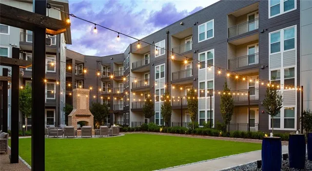 a front view of a building with a yard