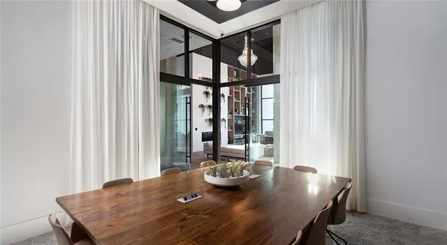 a view of a dining room with furniture and window