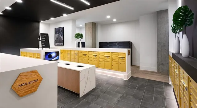 a kitchen with a refrigerator and a stove top oven