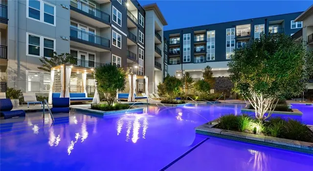 a view of a house with swimming pool yard and outdoor seating