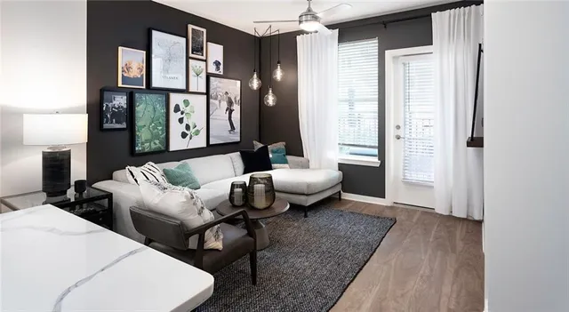 a living room with furniture and a rug