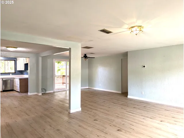 a view of a livingroom with wooden floor