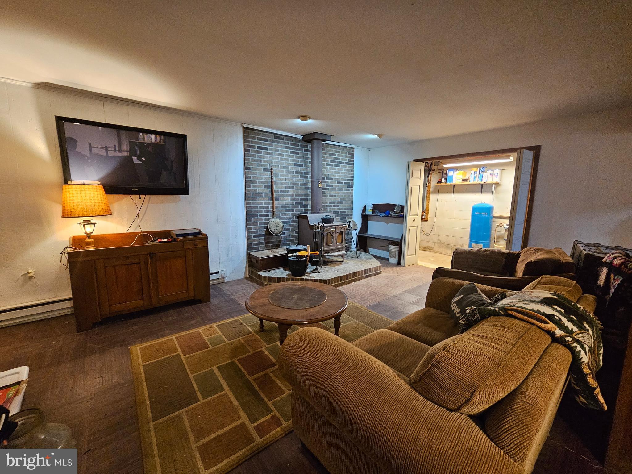 2733 Bachman Road Westminster, MD 21157 - Photo 20 of 43 a living room with furniture and a flat screen tv