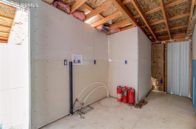 9765 Berridge Road Calhan, CO 80808 - Photo 27 of 27 Miscellaneous room featuring concrete floors