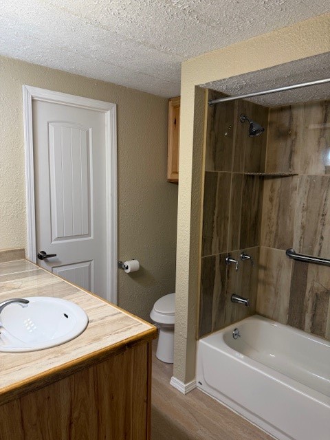 22786 Cuttler Road New Caney, TX 77357 - Photo 11 of 12 The Guest bathroom features a warm, neutral color scheme with a tiled shower-bathtub combo, a single sink vanity with a stone countertop,