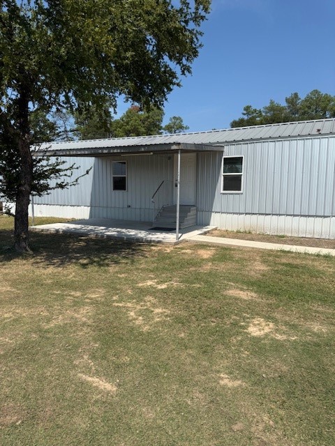 22786 Cuttler Road New Caney, TX 77357 - Photo 2 of 12 This photo shows a single-story home with a covered front porch and steps leading to the entrance.