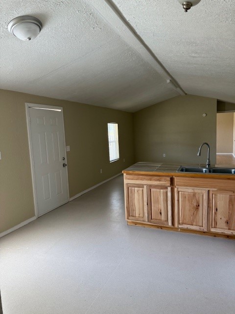22786 Cuttler Road New Caney, TX 77357 - Photo 5 of 12 This photo shows a spacious room with neutral- walls. It features kitchen and living room.