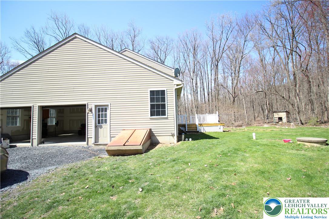 312 Old Grade Road Wind Gap, PA 18091 - Photo 54 of 54 a backyard of a house with table and chairs