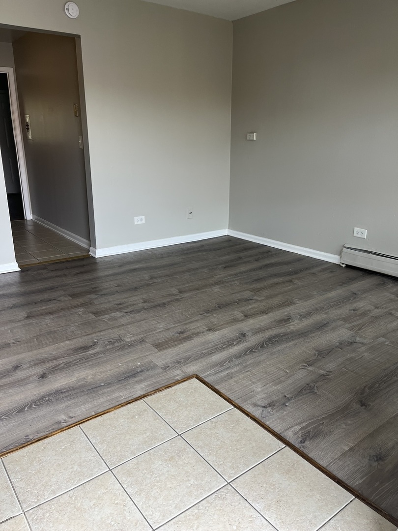 1340 North Main Street, Unit A7 Wheaton, IL 60187 - Photo 3 of 7 a view of wooden floor