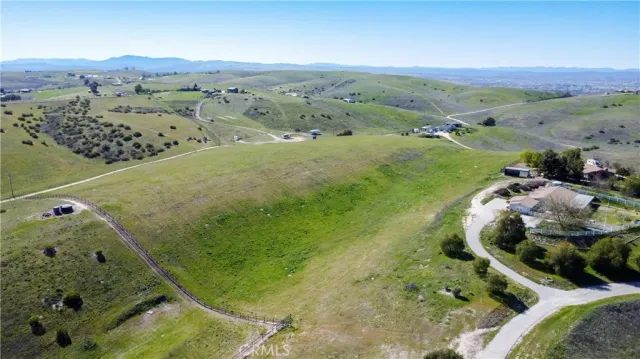 an aerial view of a golf course with parking