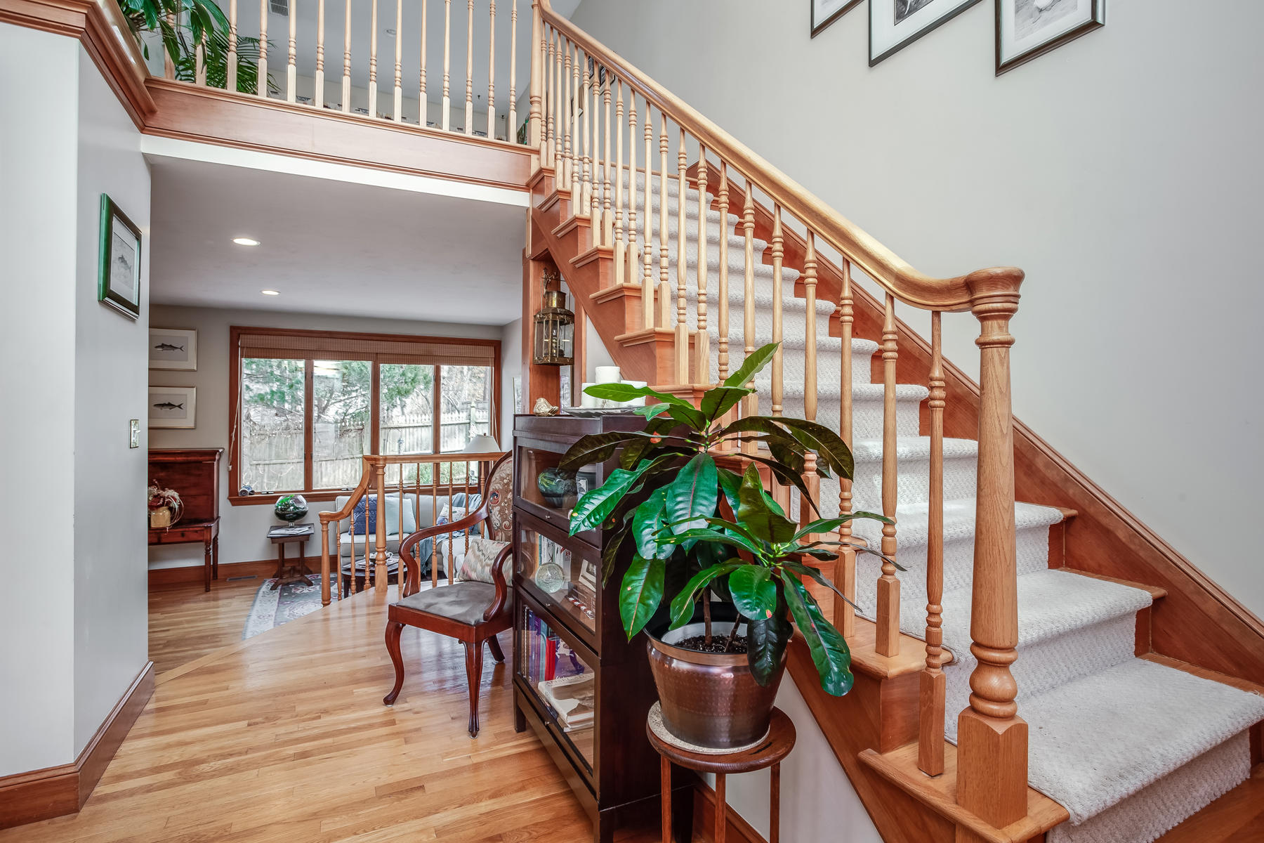 133 Summersea Road Mashpee, MA 02649 - Photo 8 of 45 a dining room with furniture potted plants and wooden floor
