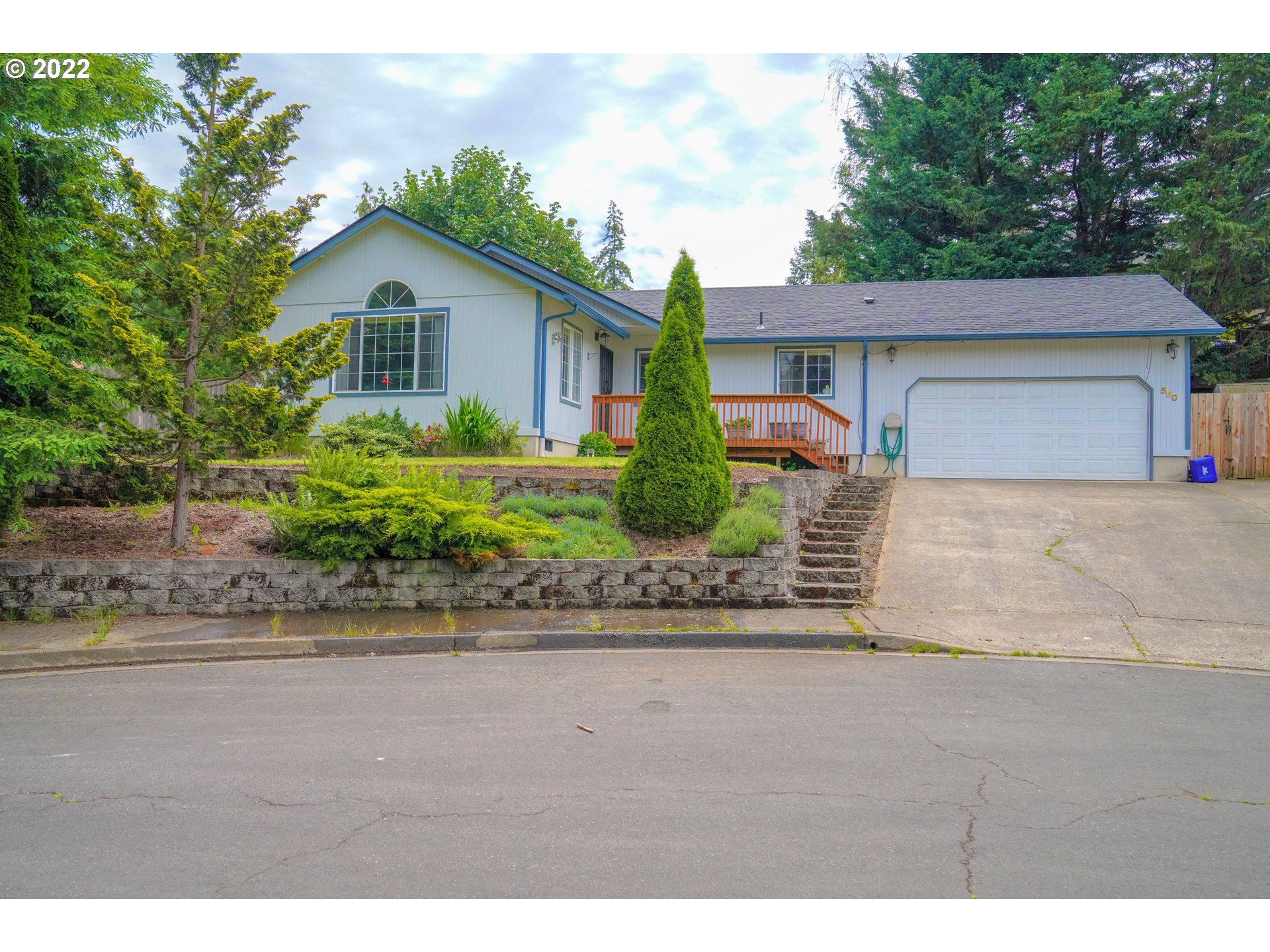 560 South 70th Street Springfield, OR 97478 - Photo 1 of 21 a front view of a house with a yard and a garage