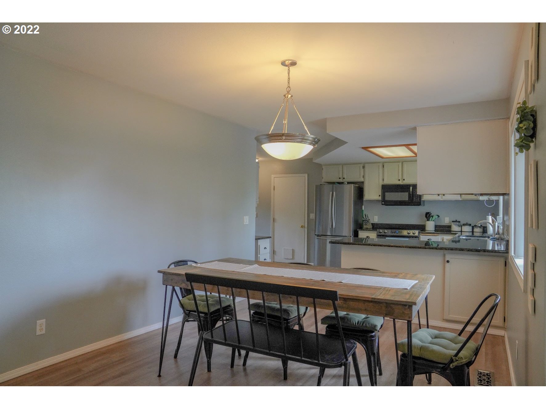 560 South 70th Street Springfield, OR 97478 - Photo 6 of 21 a kitchen with a table and chairs in it