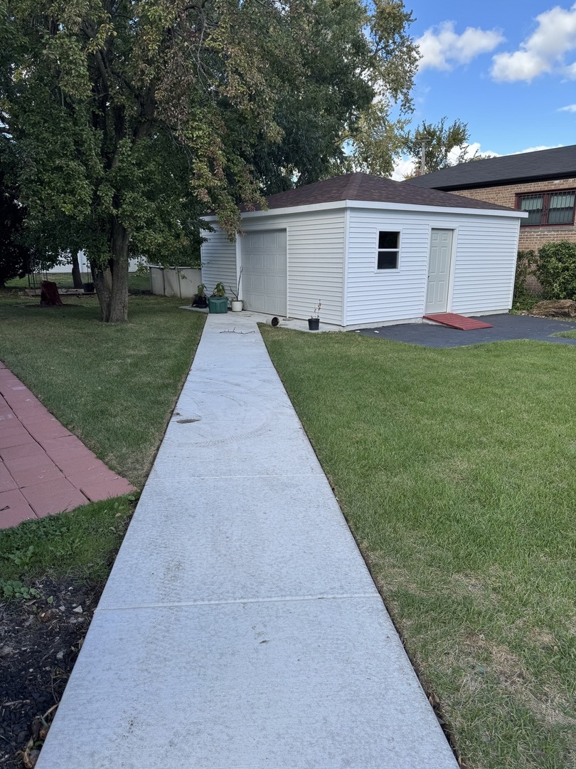 7142 South Damen Avenue Chicago, IL 60636 - Photo 16 of 20 a front view of house with yard