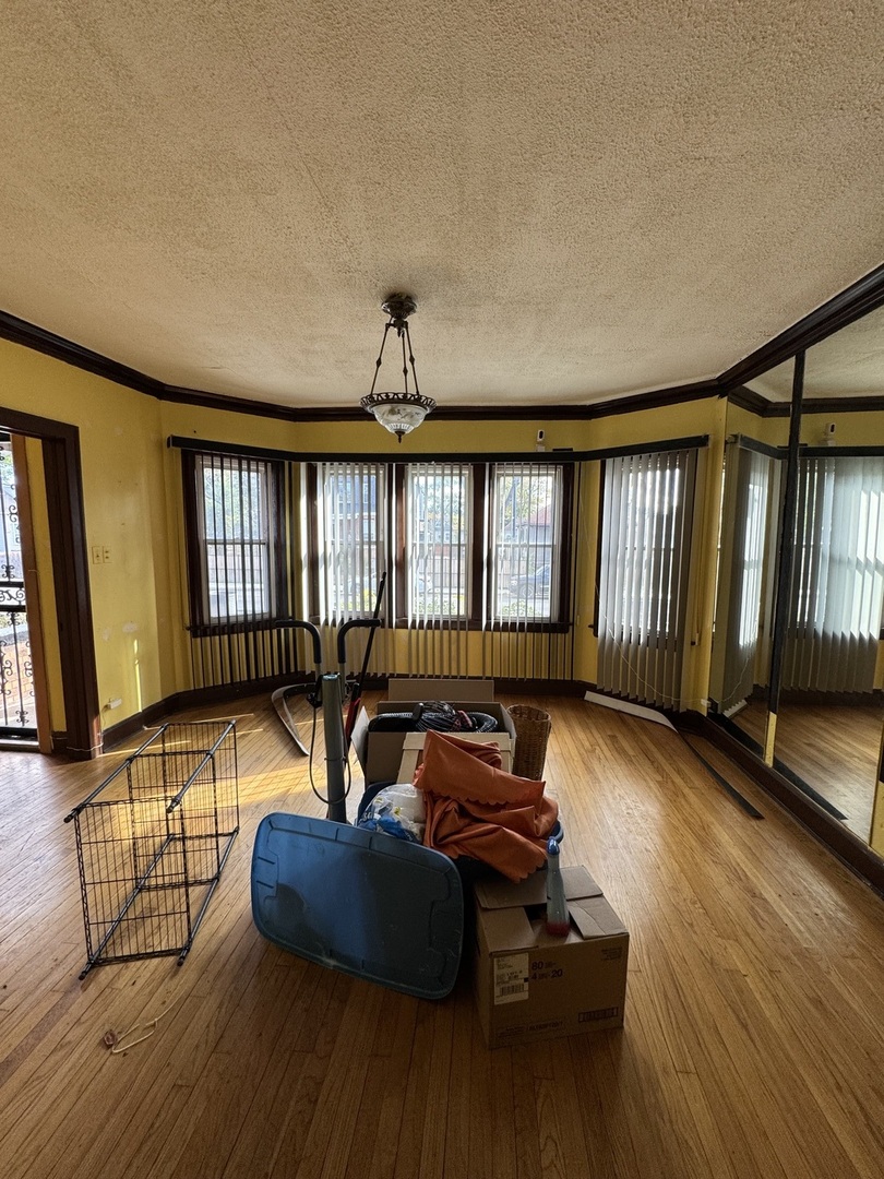 7142 South Damen Avenue Chicago, IL 60636 - Photo 2 of 20 a living room with furniture and wooden floor