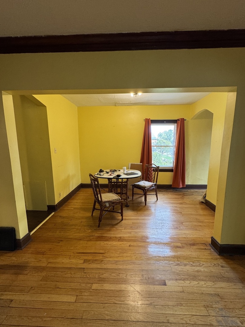 7142 South Damen Avenue Chicago, IL 60636 - Photo 4 of 20 a view of a dining room with furniture and wooden floor