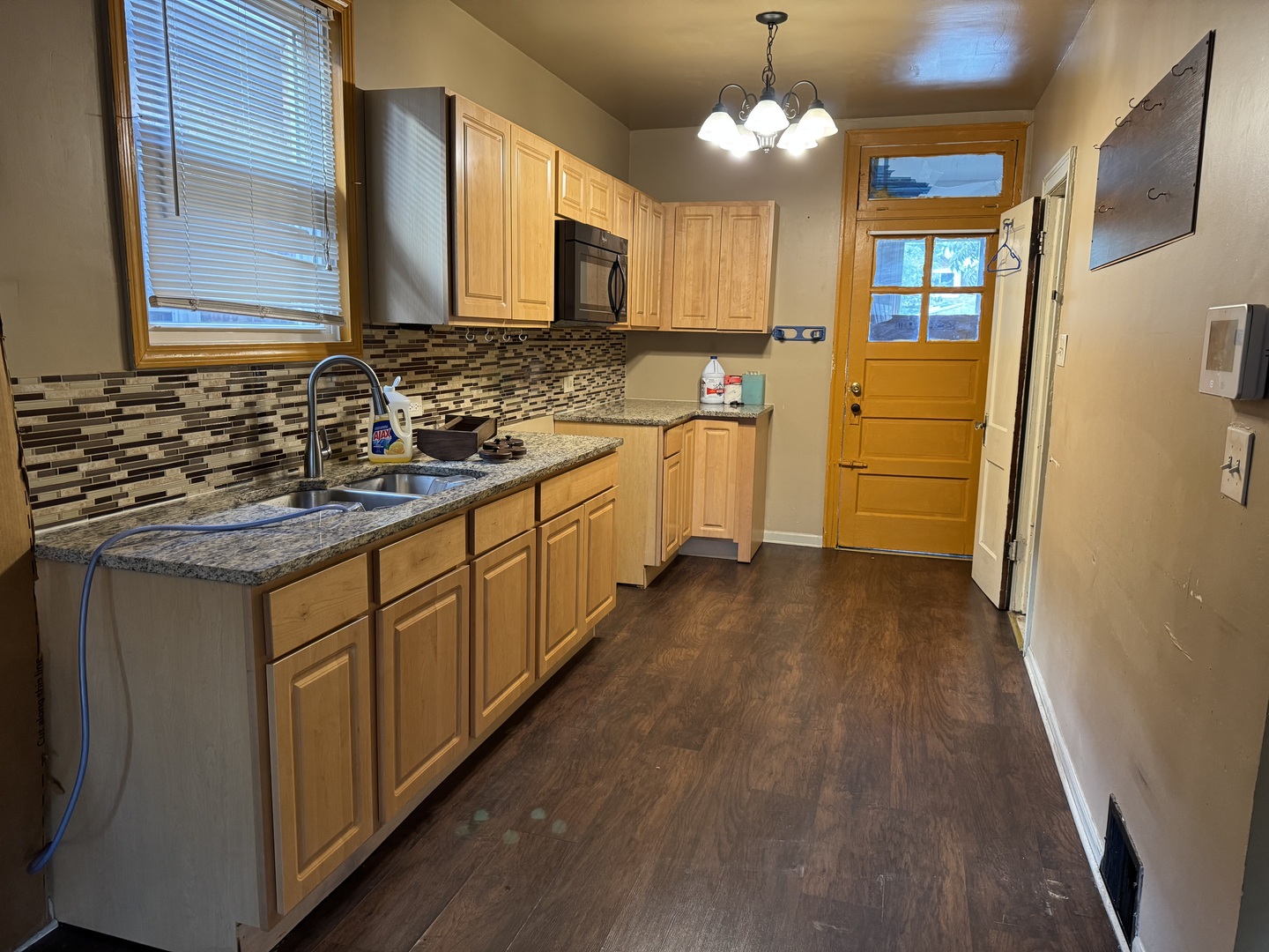 7142 South Damen Avenue Chicago, IL 60636 - Photo 5 of 20 a kitchen with a sink stove and refrigerator
