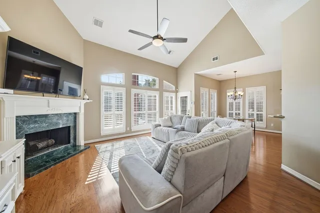 a living room with furniture fireplace and flat screen tv