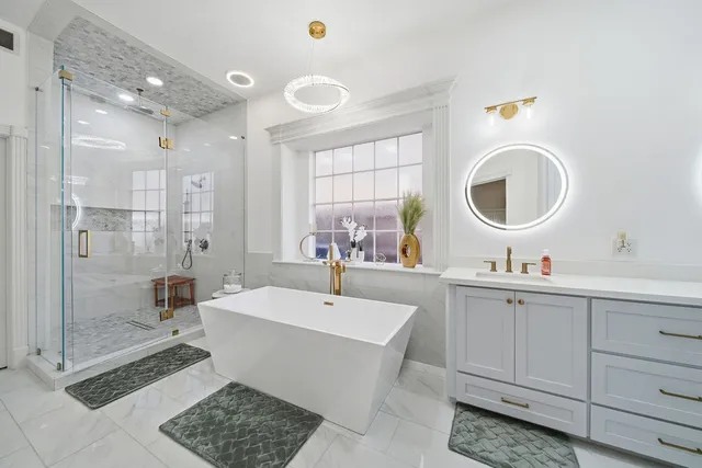 a bathroom with a double vanity sink a mirror and a shower