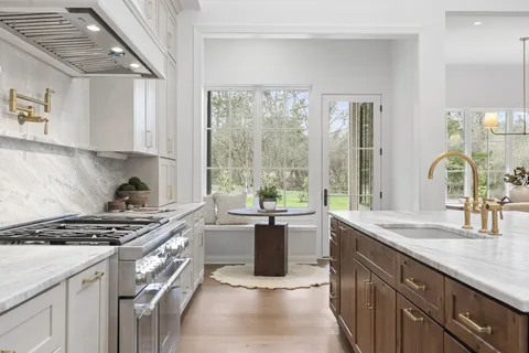 a view of a dining room with furniture and window
