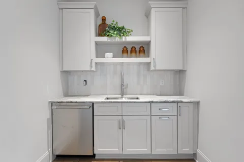 a view of a hallway with stairs