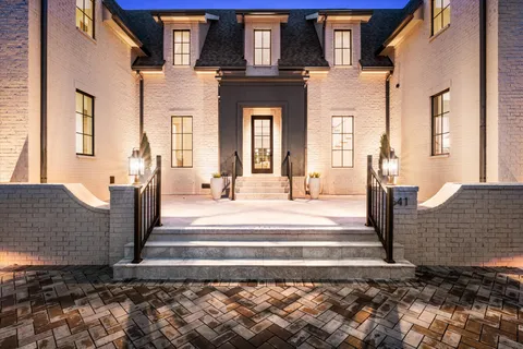 a kitchen with granite countertop stainless steel appliances a sink and cabinets