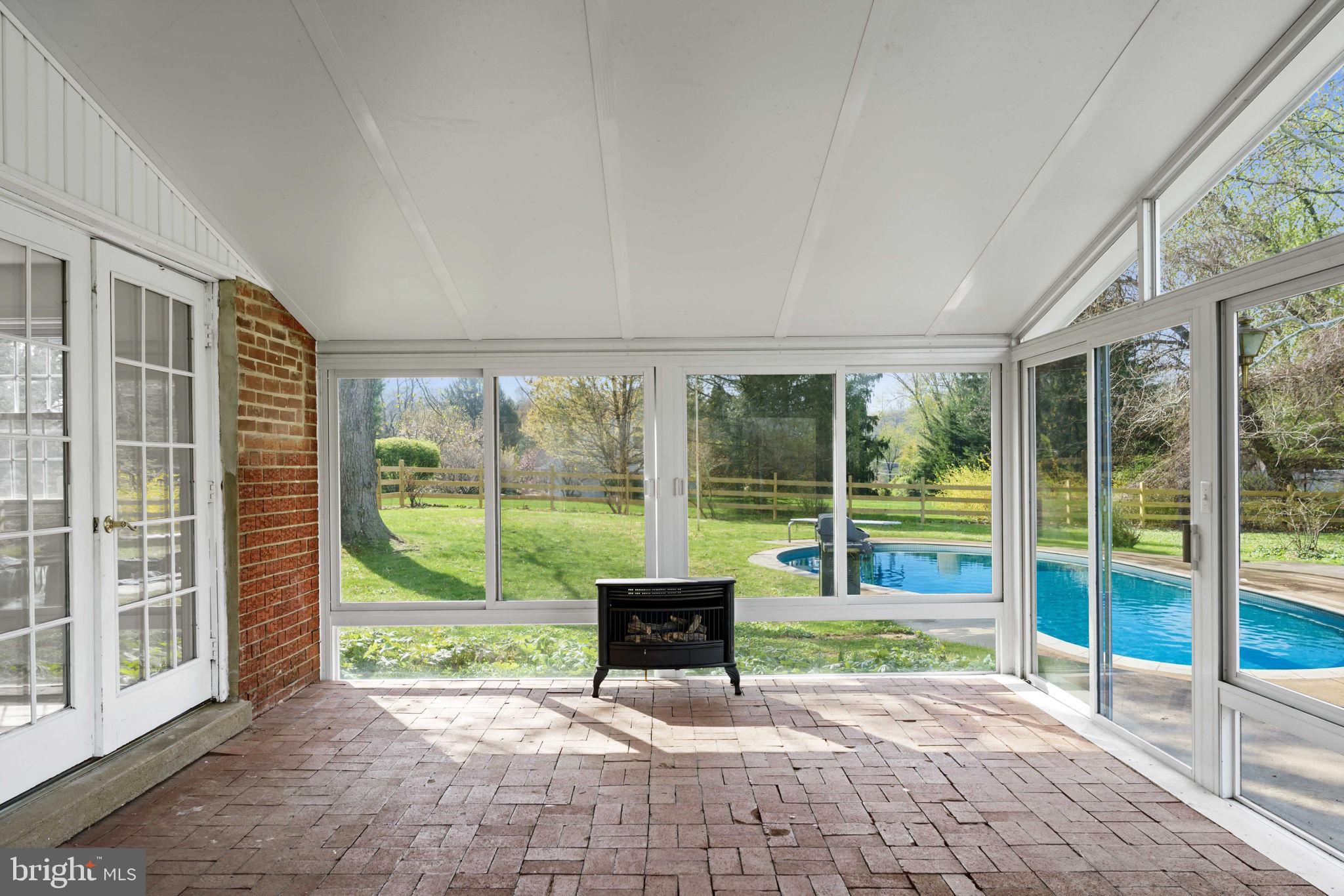 931 Jones Road Conshohocken, PA 19428 - Photo 11 of 66 Sun Room with View of Pool