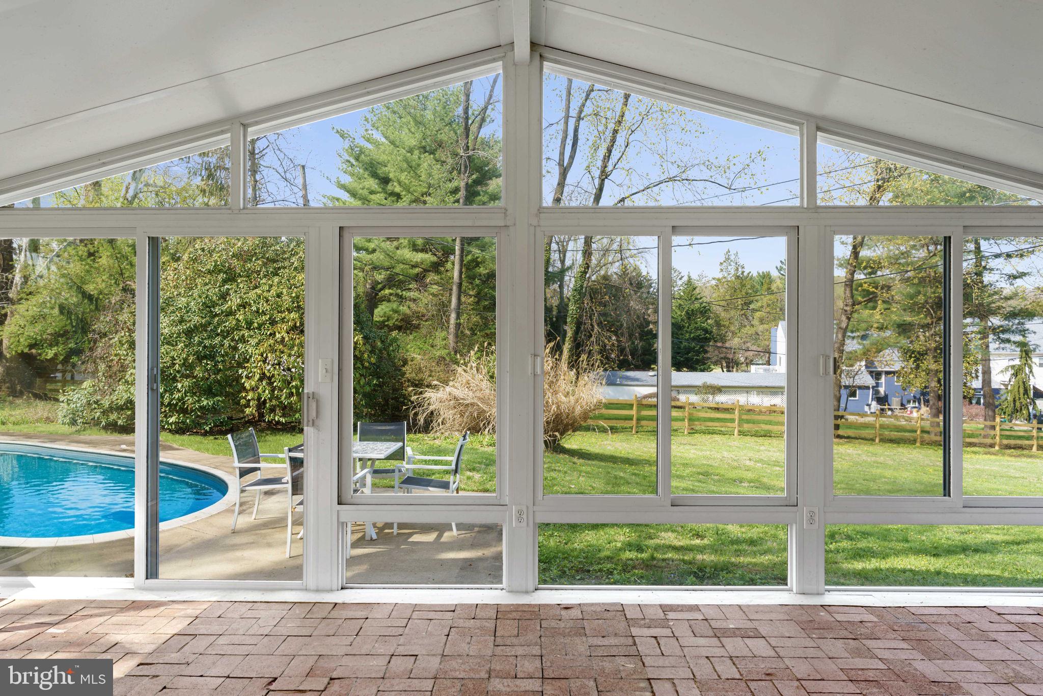931 Jones Road Conshohocken, PA 19428 - Photo 12 of 66 Sun Room with View of Back Yard