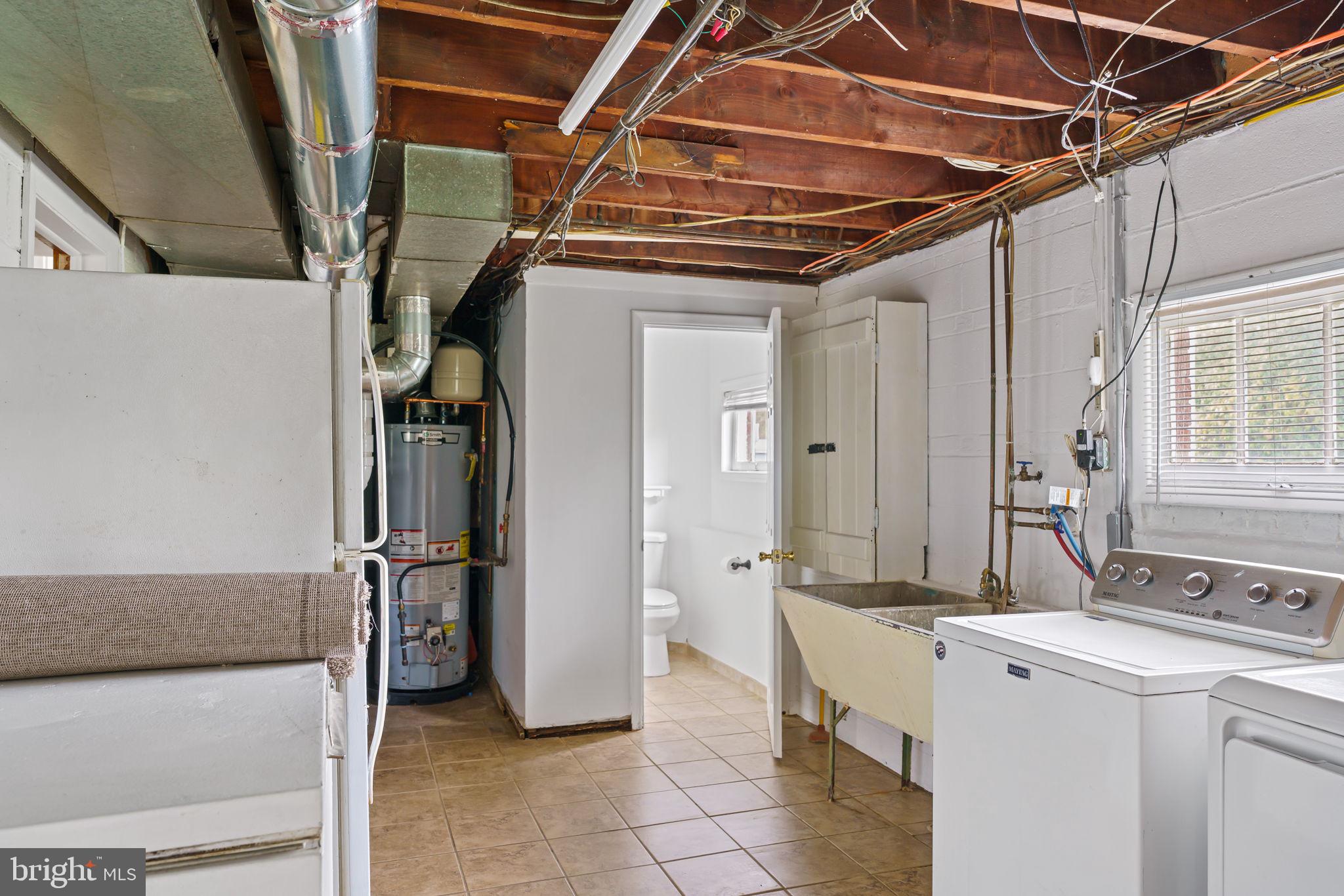 931 Jones Road Conshohocken, PA 19428 - Photo 57 of 66 Laundry Room with View to Half Bathroom