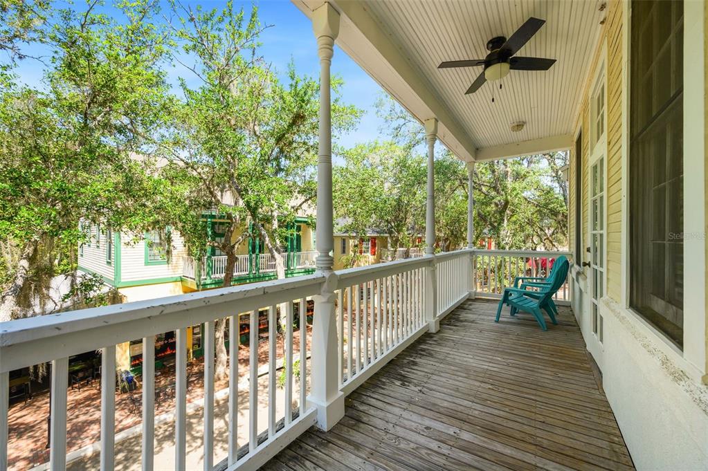 5213 Southwest 91 Terrace, Unit B Gainesville, FL 32608 - Photo 24 of 38 a view of a balcony with chairs
