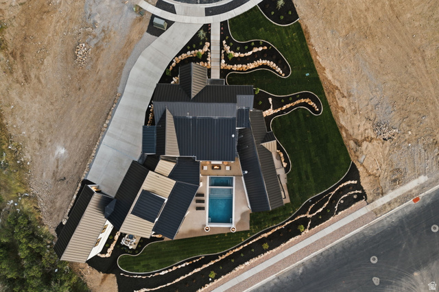 923 North Emery Lane Elk Ridge, UT 84651 - Photo 94 of 101 Modern property featuring a rectangular pool, integrated spa, and manicured lawn