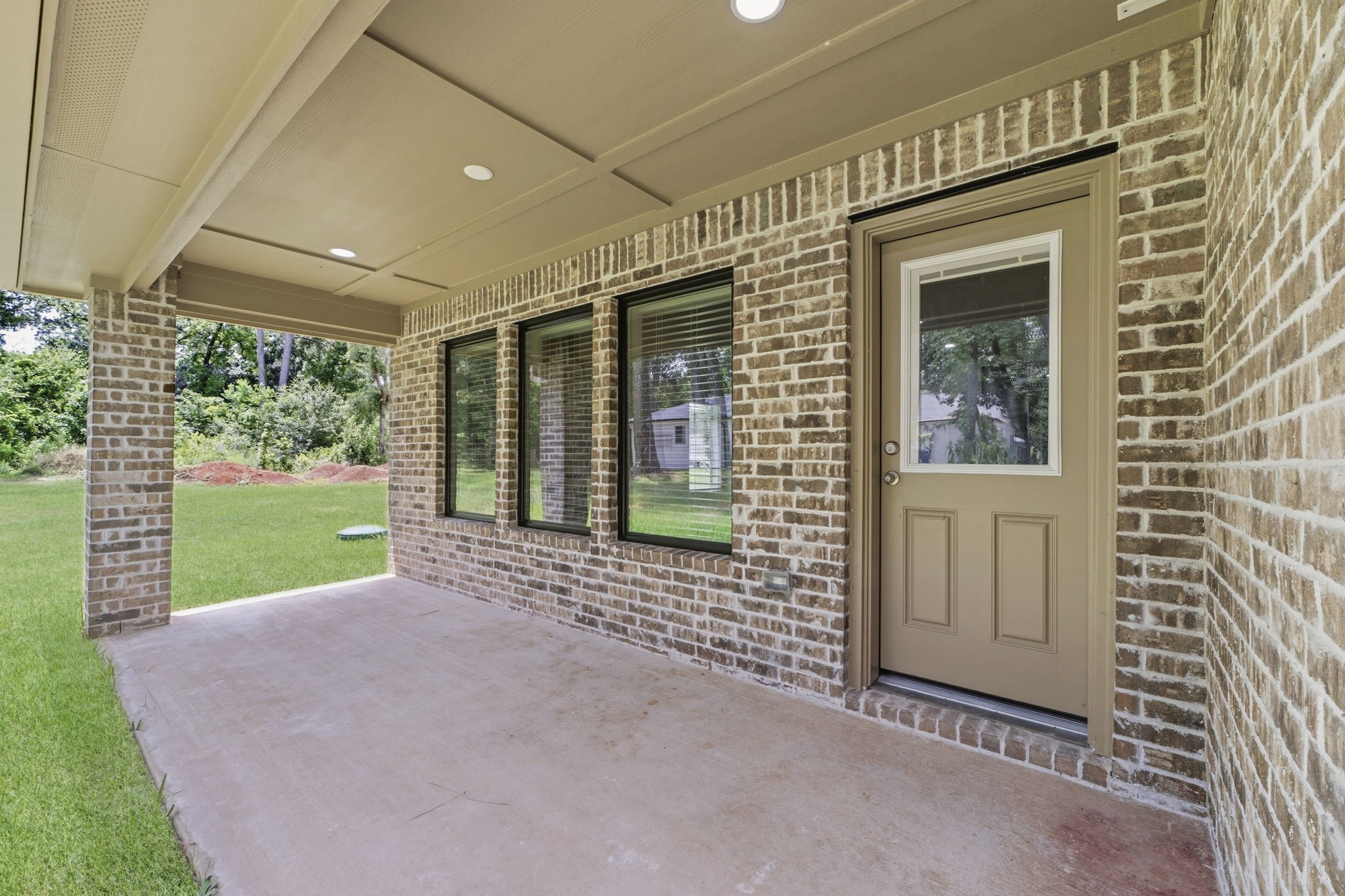 23620 Youpon Lane Spring, TX 77389 - Photo 31 of 37 Covered back patio, perfect for outdoor dining, entertaining, an relaxing year round.