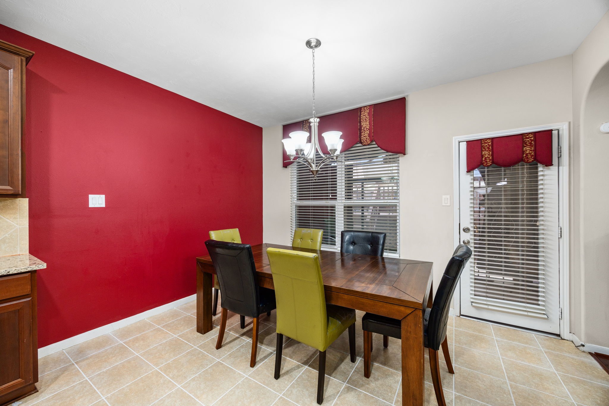 6719 Latchmore Lane Houston, TX 77049 - Photo 10 of 46 a view of a dining room with furniture and chandelier