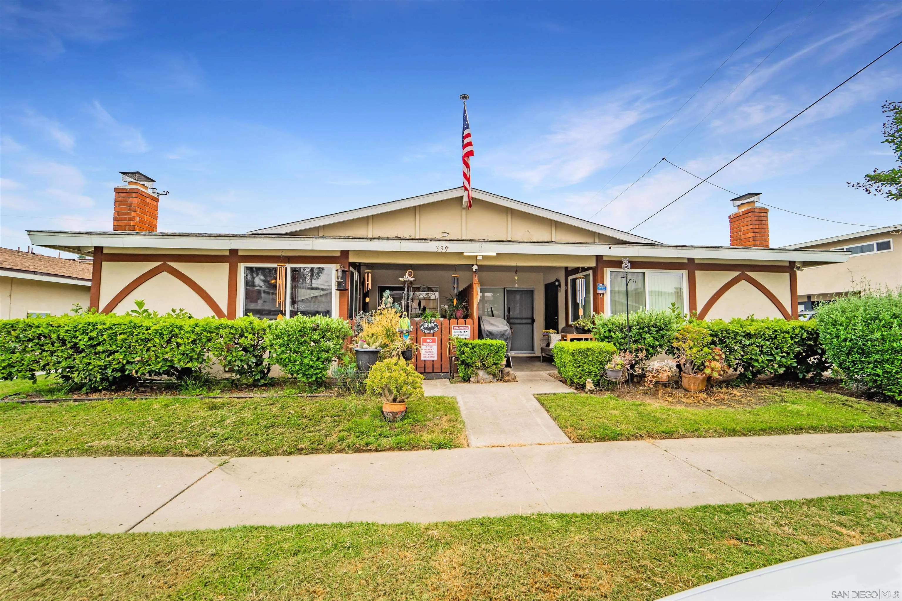 399 Compton Street El Cajon, CA 92020 - Photo 5 of 14 a front view of a house with garden