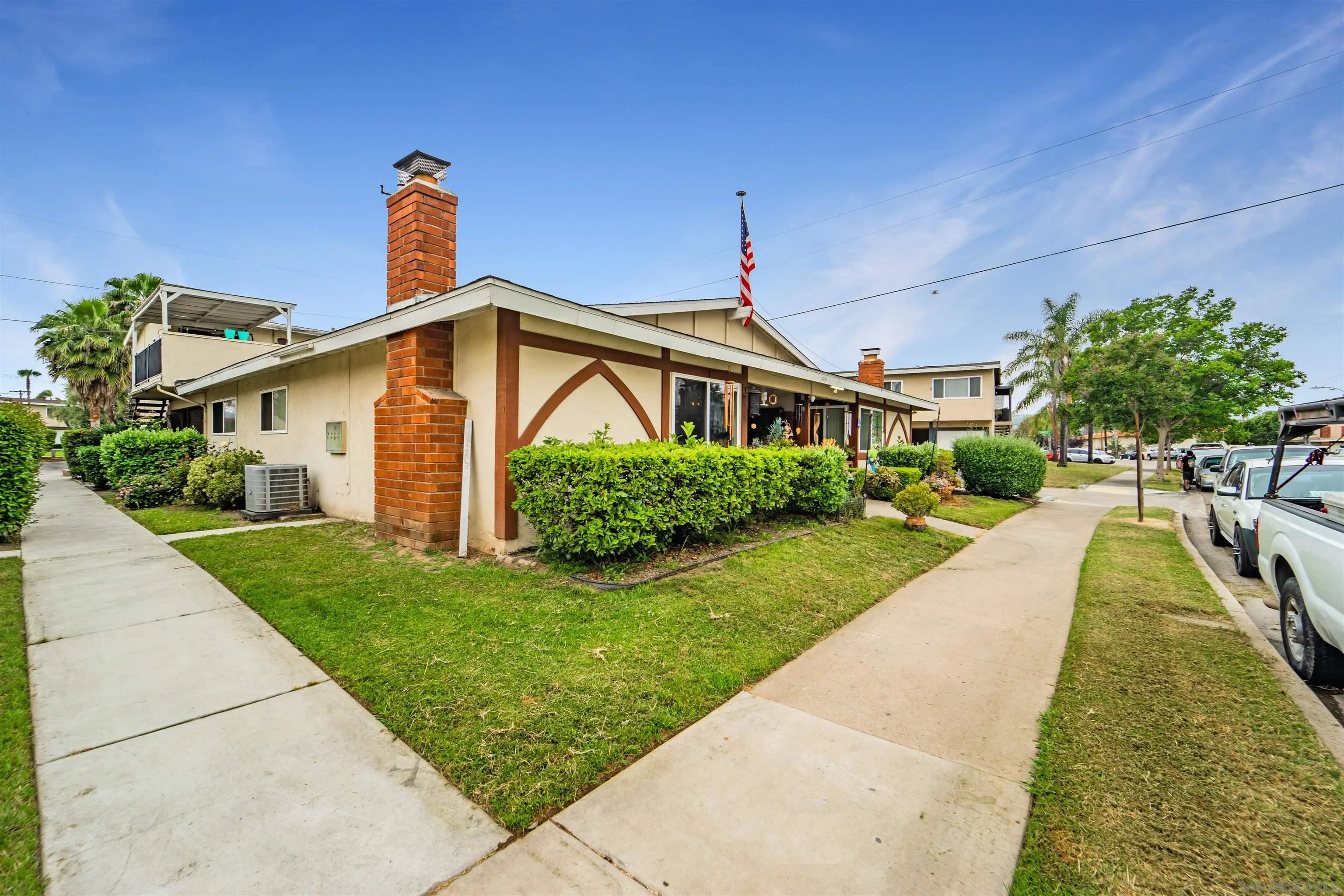 399 Compton Street El Cajon, CA 92020 - Photo 6 of 14 a front view of a house with a yard