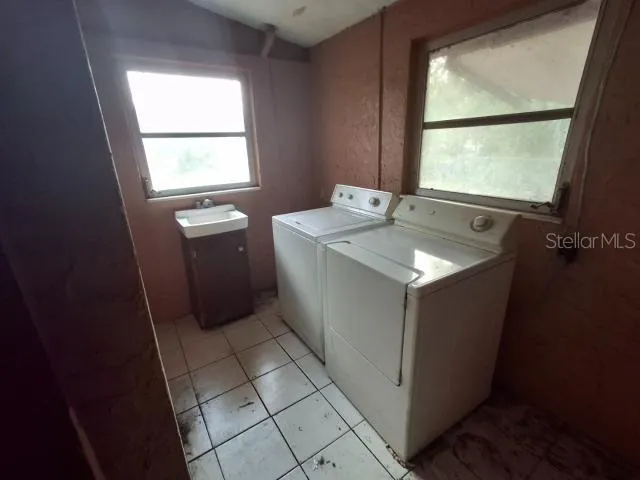 a bathroom with a glass door shower