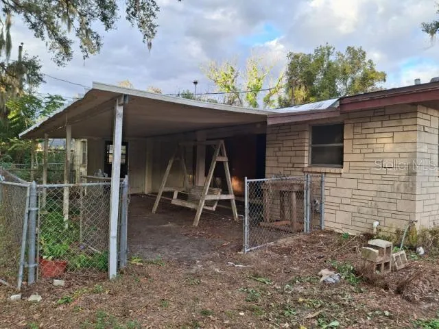 a view of a house with a porch and furniture
